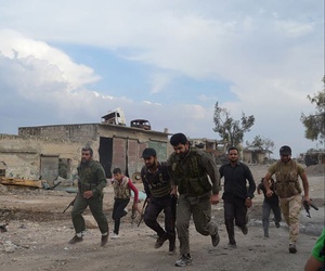 Members of the Free Syrian Army run at the front lines in the town of Sheikh Najjar, in Aleppo, Syria, on June 10, 2014. Members of the Free Syrian Army run at the front lines in the town of Sheikh Najjar, in Aleppo, Syria, on June 10, 2014.