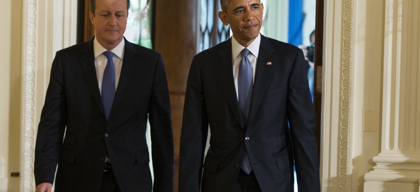 President Barack Obama and British Prime Minister David Cameron arrive for a joint news conference in the East Room of the White House, on Jan. 16, 2015.