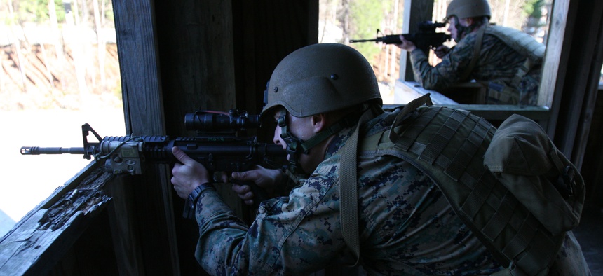 Marines with the Marine Special Operations Support Group fire at targets during the Special Operations Training Course aboard Camp Lejeune, on Dec. 7 2010.