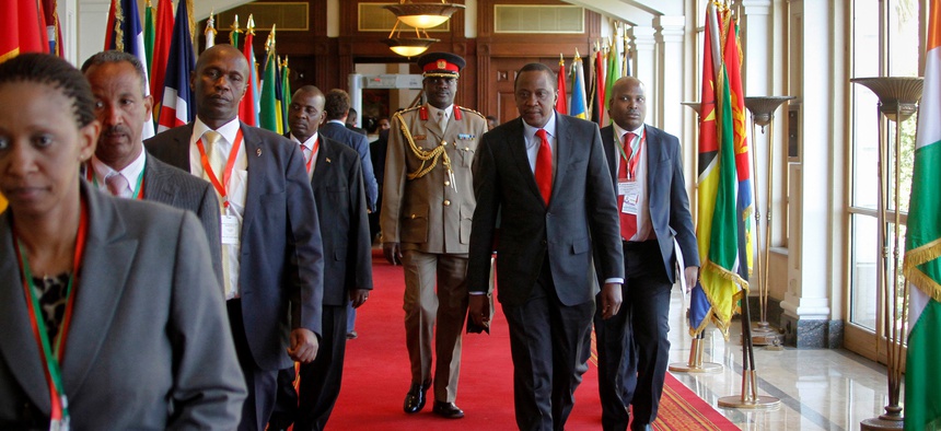 Kenya's President Uhuru Kenyatta, center foreground, arrives for the Intergovernmental Authority on Development (IGAD) summit, held on the eve of the heads of state meeting of the African Union summit, in Addis Ababa, Ethiopia, Jan. 29, 2015.