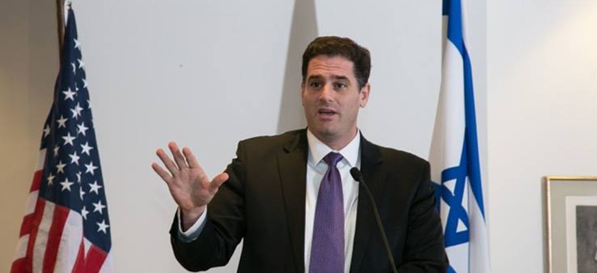 Israel's Ambassador to the U.S. Ron Dermer speaks in front of a crowd at the Israeli Embassy in Washington, D.C.