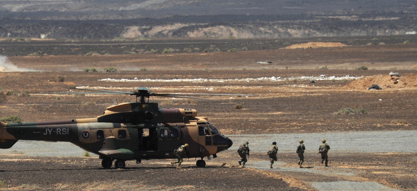 Special operations troops from the Royal Jordanian Armed Forces unload from an AS332 Super Puma during Exercise Eager Tiger, on May 14, 2014.