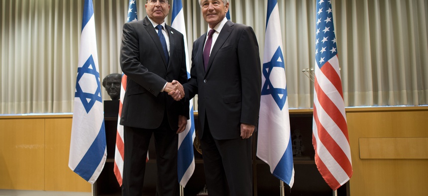 Secretary of Defense Chuck Hagel poses for a photo with Israeli Minister of Defense Moshe Ya'alon in Tel Aviv, Israel, on May 15, 2014.