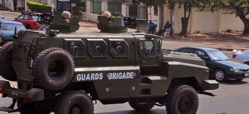 Nigerian soldiers patrol with a armored vehicle in the city of Abuja, Nigeria, Saturday, Feb. 7, 2015.