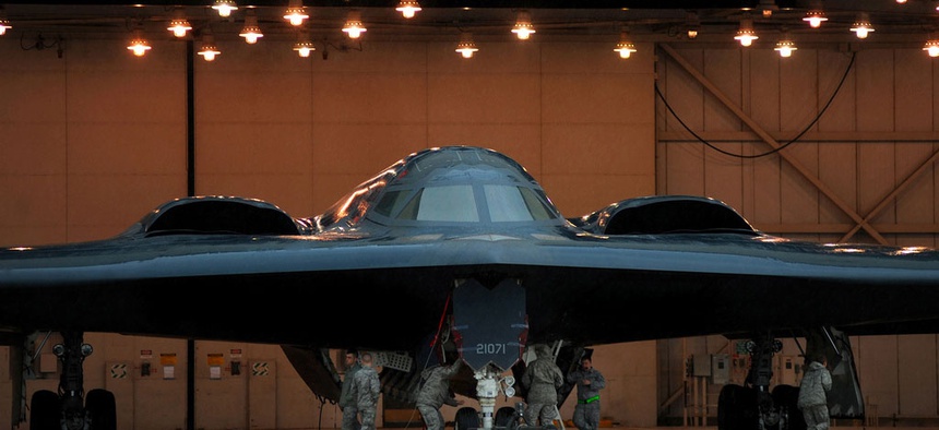 U.S. Air Force crew chiefs and other maintainers from the 509th Aircraft Maintenance Squadron prepare U.S. Air Force B-2 Spirit stealth bombers at Whiteman Air Force Base. Mo., March 19, 2011.