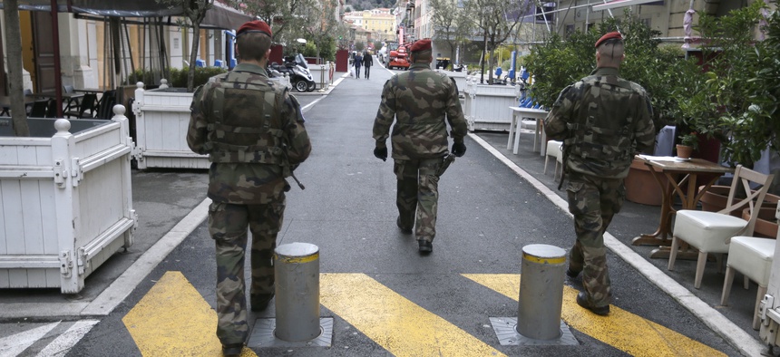 Soldiers patrol in a street in Nice, southeastern France, Wednesday, Feb. 4, 2015.