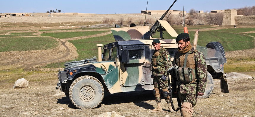 Afghan National Army soldiers provide security during a patrol, on Feb. 14, 2012.