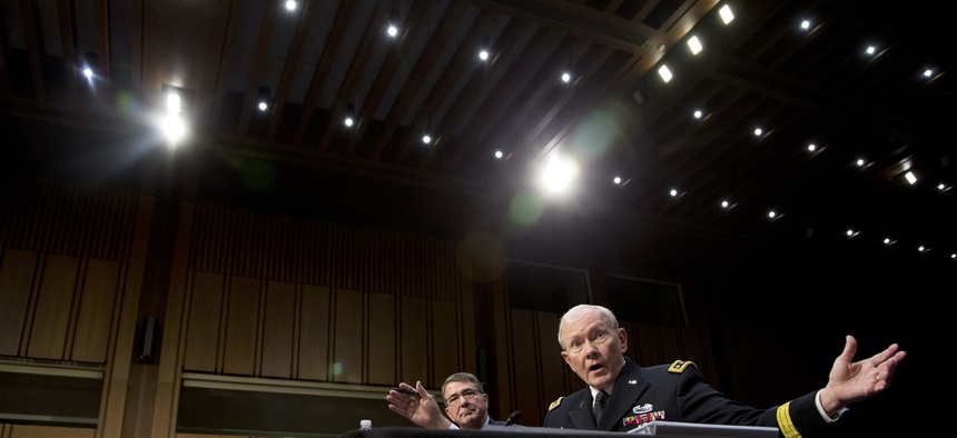 Gen. Martin Dempsey, alongside Defense Secretary Ash Carter, testifies in front of the Senate Armed Services Committee, on March 3, 2015.