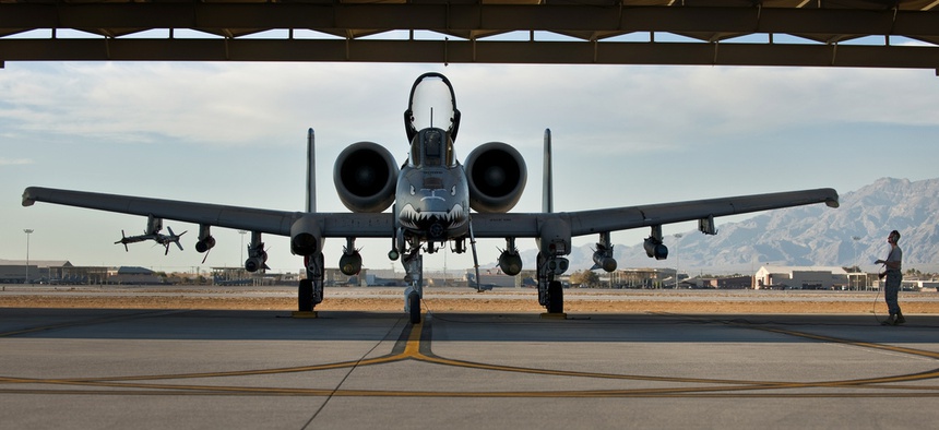 An Air Force NCO with the 23rd Aircraft Maintenance Squadron from Moody Air Force Base, Ga., conducts pre-flight checks on an A-10 Thunderbolt II before a training mission at Green Flag West 11-2 exercise at Nellis Air Force Base, on Dec. 6, 2010.
