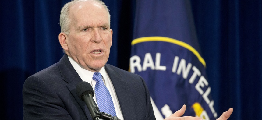 Central Intelligence Director (CIA) Director John Brennan gestures during a news conference at CIA Headquarters in Langley, Va., Thursday, Dec. 11, 2014