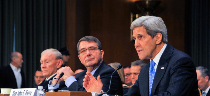 U.S. Secretary of State John Kerry delivers testimony alongside Defense Secretary Ash Carter and Joint Chiefs of Staff Chairman Army General Martin Dempsey before the Senate Foreign Relations Committee on March 11, 2015.