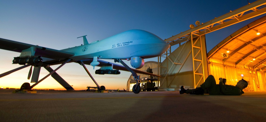 A Predator drone with the 163rd Reconnaissance Wing is shown during post-flight inspection at dusk from Southern California Logistics Airport, formerly George Air Force Base, in Victorville, Calif., Jan. 7, 2012.