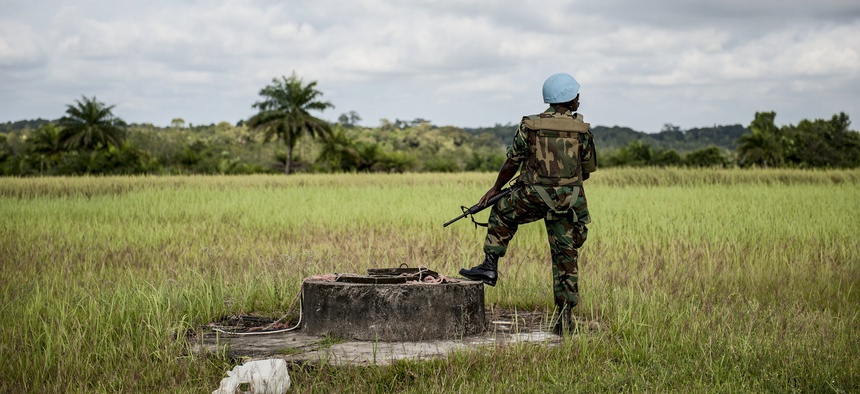 A Ghanaian peacekeeper with the UN Mission in Liberia is pictured on guard duty in Cestos City, Liberia.