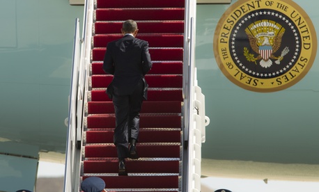 President Barack Obama climbs the steps of Air Force One before departure at Andrews Air Force Base, Md., Wednesday, March 18, 2015. President Barack Obama climbs the steps of Air Force One before departure at Andrews Air Force Base, Md., Wednesday, March 18, 2015.