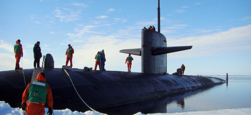 The USS Providence is moored at the North Pole to commemorate the 50th anniversary of the first submarine polar transit.