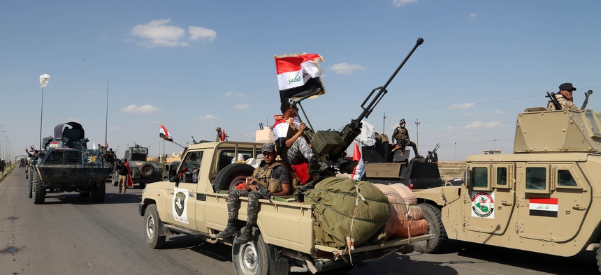 Iraqi security forces prepare to attack Islamic State extremist positions in Tikrit, 130 kilometers (80 miles) north of Baghdad, Iraq, Thursday, March 26, 2015.