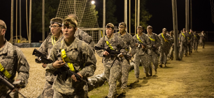Soldiers cool down after a two-mile run with their assigned weapons, before participating in an obstacle course on Fort Benning, Ga., Feb. 7, 2015.