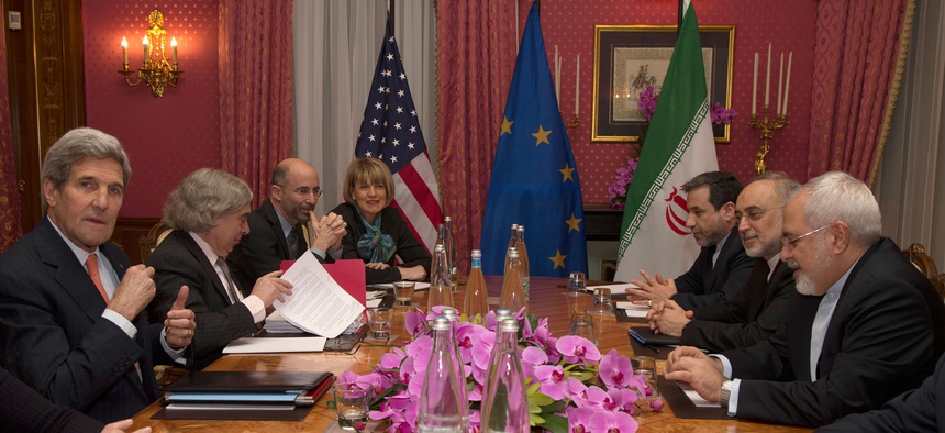 US Secretary of State John Kerry, left, holds a negotiation meeting with Iran's Foreign Minister Javad Zarif, seated opposite, over Iran's nuclear program, in Lausanne, Switzerland, March 19, 2015.