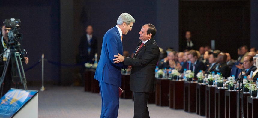 Egyptian president al-Sisi thanks Secretary of State John Kerry after an address at Sharm el-Sheik, on March 13, 2015.