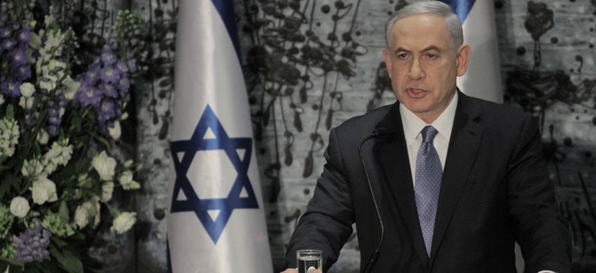 Israeli Prime Minister Benjamin Netanyahu speaks during a ceremony with Israeli President Reuven Rivlin, not seen, in Jerusalem, Wednesday, March 25, 2015.