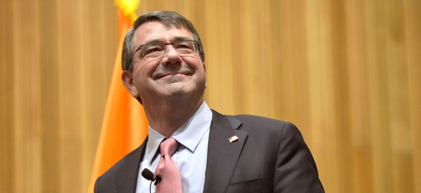 Defense Secretary Ash Carter greets the audience before participating in a roundtable discussion with members of the Institute for Veterans and Military Families at Syracuse University in Syracuse, N.Y., March 31, 2015.