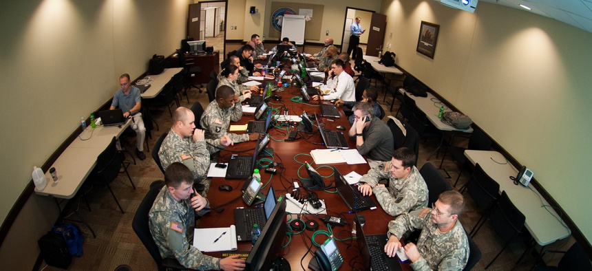 Army Reserve computer tech support experts answer calls during the Enterprise Email Migration at the U.S. Army Forces Command and U.S Army Reserve Command headquarters, Jan. 14, 2013.