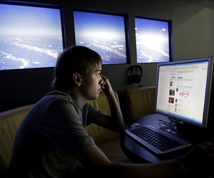 A man visits a Russian site at an internet cafe in Moscow. A man visits a Russian site at an internet cafe in Moscow.