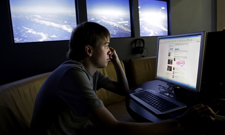 A man visits a Russian site at an internet cafe in Moscow. A man visits a Russian site at an internet cafe in Moscow.