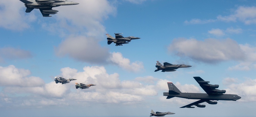 U.S. Air Force, Japan Air Self-Defense Force and Royal Australian Air Force aircraft fly in formation off the coast of Guam during Cope North 15, Feb. 17, 2015.