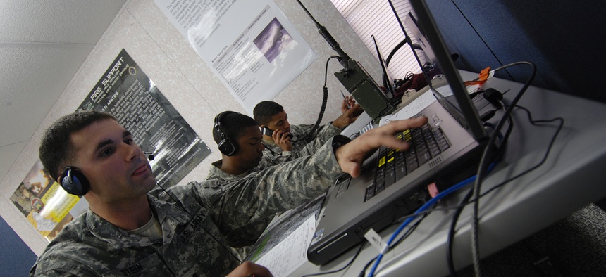 An officer with the 82nd Airborne Division calls in close air support during an exercise at the Battle Command Training Center.