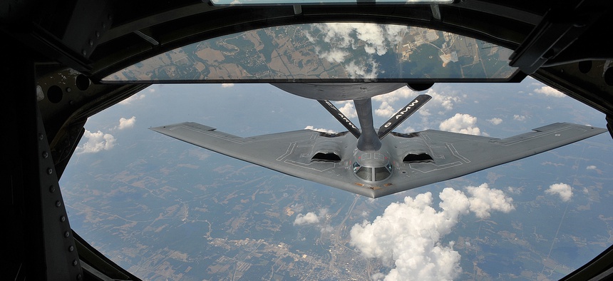 A KC-135 Stratotanker from the 22nd Air Refueling Wing refuels a B-2 Spirit from the 509th Bomb Wing, July 12, 2012.