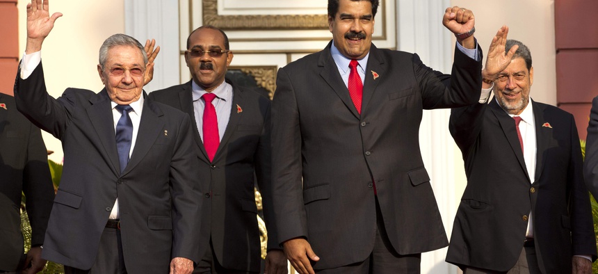 Cuba's President Raul Castro, Prime Minister of Antigua and Barbuda Gaston Browne, Venezuela's President Nicolas Maduro, and Saint Vincent and the Grenadines Prime Minister Ralph Gonsalves pose for a group photo on March 17, 2015.