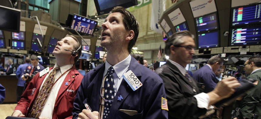 In this May 7, 2010, file photo traders work on the floor of the New York Stock Exchange in New York, following a flash crash.