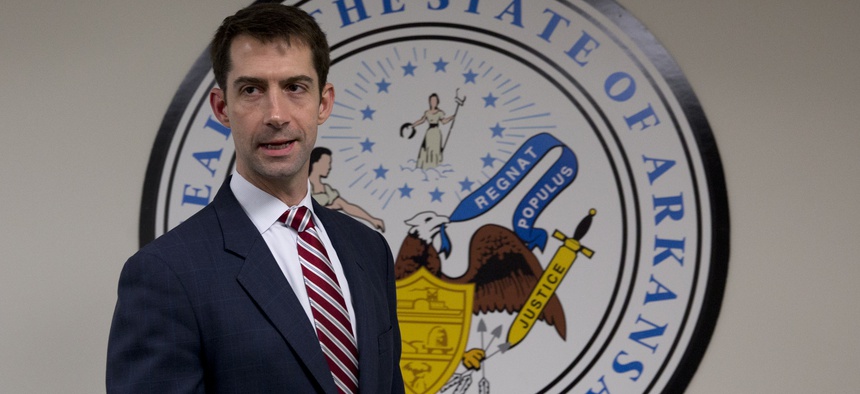 Sen. Tom Cotton, R-Ark. arrives to pose for photographers in his office on Capitol Hill in Washington, Wednesday, March 11, 2015.