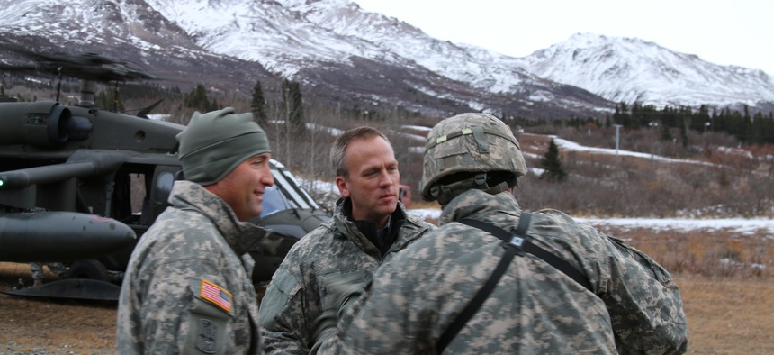 Under Secretary of the Army Brad Carson, along with Maj. Gen. Michael H. Shields, commanding general of U.S Army Alaska, arrive at Black Rapids Training Site, Nov. 18, 2014.