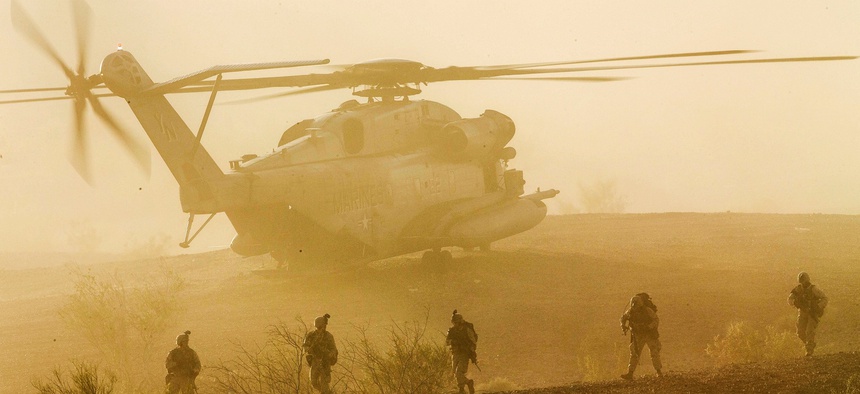 Marines with 1st Battalion, 5th Marine Regiment, participate in a heavy helo raid during Weapons and Tactics Instructor Course 2-15 at K-9 Village, Yuma Proving Grounds, Arizona, April 8, 2015.