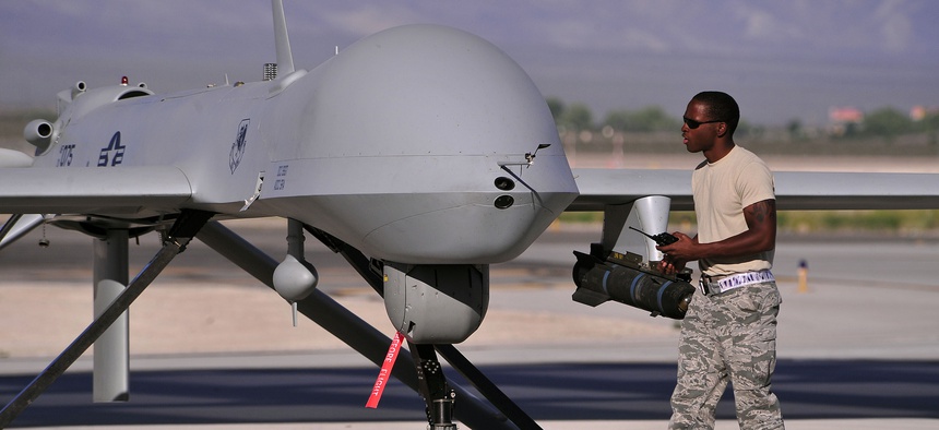 A dedicated crew chief prepares an MQ-1B remotely piloted aircraft for a training mission, May 13, 2013.