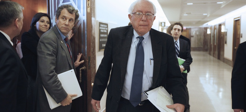 Sen. Bernard Sanders, I-Vt., right, and Sen. Sherrod Brown, D-Ohio, emerge from a closed meeting of the Social Security caucus, Thursday, Jan. 27, 2011.