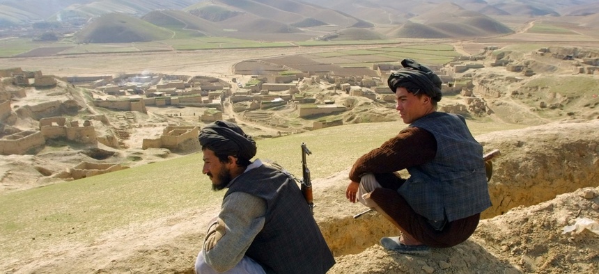 Afghan militiamen, Gen. Rashid Dostum-aligned fighters, are on guard on a hill over Karnai village, 80 kilometers (50 miles) south of Mazar-e- Sharif, Thursday, Jan. 31, 2002.