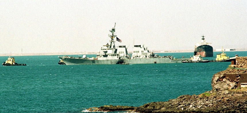 The crippled USS Cole is towed into deep water by Yemini tug boats from the port of Aden, Sunday Oct. 29, 2000.