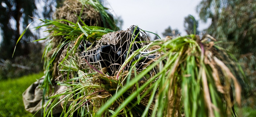 A U.S. Army sniper aims at his target during a training exercise at a Forward Observation Base in Mosul, Iraq.