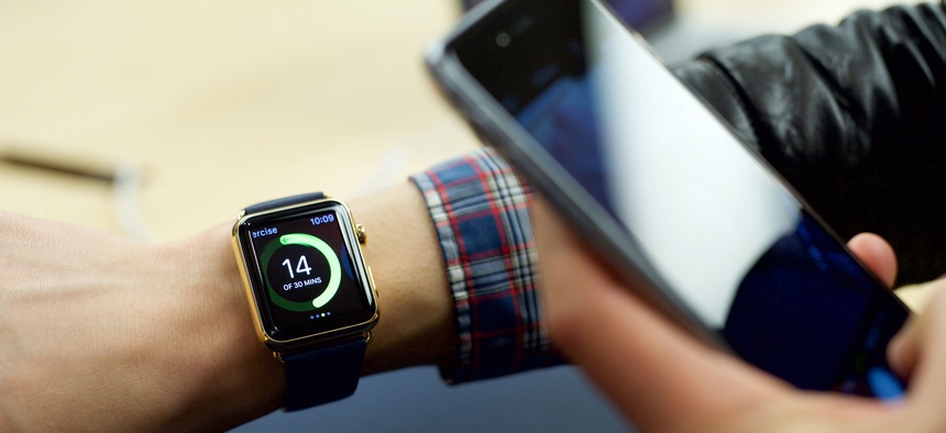 n excited customer tries on the Apple Watch Edition at the Eaton Centre Apple Store on Friday, April 10, 2015 in Toronto.~