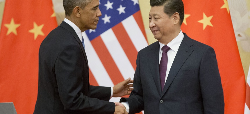 U.S. President Barack Obama, left, and Chinese President Xi Jinping shake hands following the conclusion of their joint news conference at the Great Hall of the People in Beijing, Wednesday, Nov. 12, 2014.