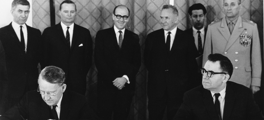 In this July 1, 1968 file photo, U.S. Ambassador Llewellyn Thompson, left, signs the Non-Proliferation Treaty alongside Soviet Foreign Minister Andrei Gromyko.