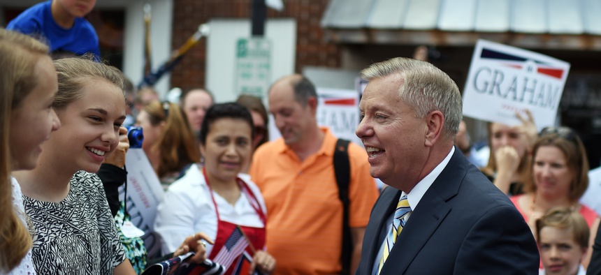 Sen. Lindsey Graham, R-S.C., greets supporters after announcing his bid for presidency, Monday, June 1, 2015.