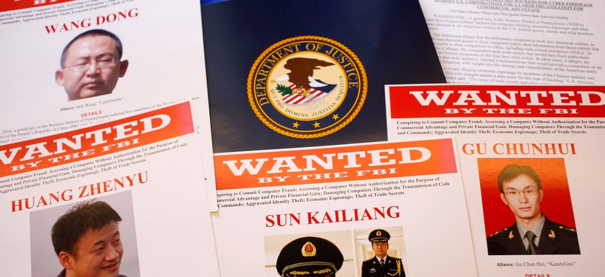 In this May 19, 2014, file photo, press materials are displayed on a table of the Justice Department in Washington.