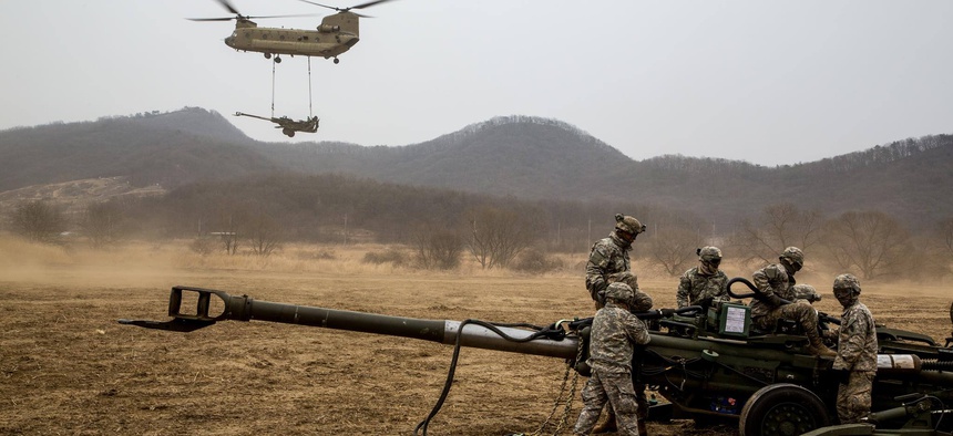 Soldiers assigned to 2nd Stryker Brigade Combat Team, 25th Infantry Division, conduct air assault sling load training on Warrior Base, New Mexico Range, in the Republic of Korea, on March 18, 2015.