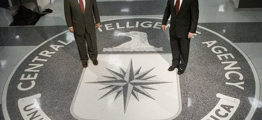 Then President George Bush (R) stands with then-CIA Director George Tenet, on March, 20, 2001.