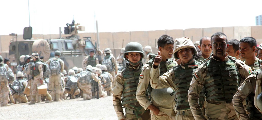 Soldiers from the 76th Iraqi Infantry Brigade receive M16A2 rifles and infantry sets as part of the fielding of combat brigade sets supplied to Iraqi Security Forces May 25, 2015, at Camp Taji, Iraq,