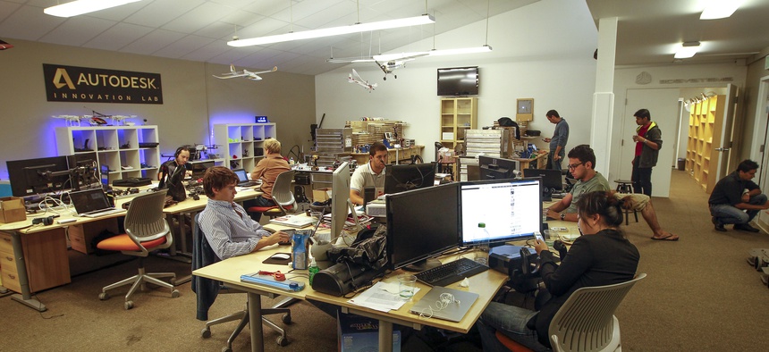 Students work in the Innovations Lab on the Singularity University campus on Tuesday, August 6, 2013 in Moffett Field, Calif.